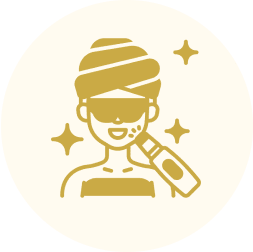 Woman receiving facial treatment with device.